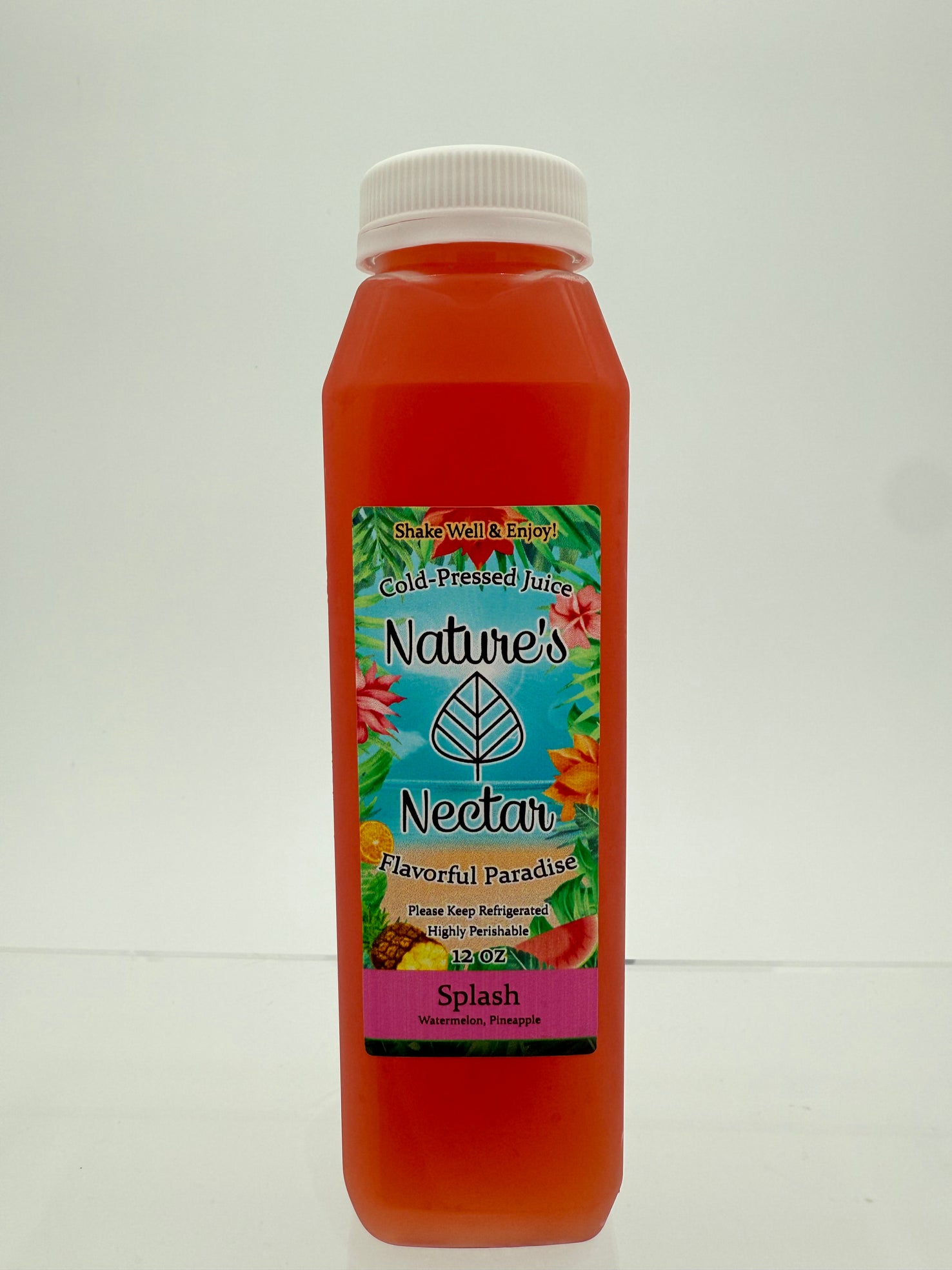 A bottle of Nature's Nectar Splash cold-pressed juice with a white cap, featuring a colorful tropical label, set against a plain light gray background.